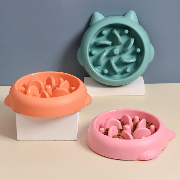 Anti-Gulp Slow Feeder Bowl with maze design to slow fast-eating dogs and cats, shown in green, pink and orange